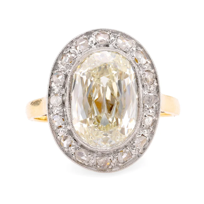 Edwardian GIA 5.02 Carat Cushion Diamond 18K Yellow Gold Cluster Ring