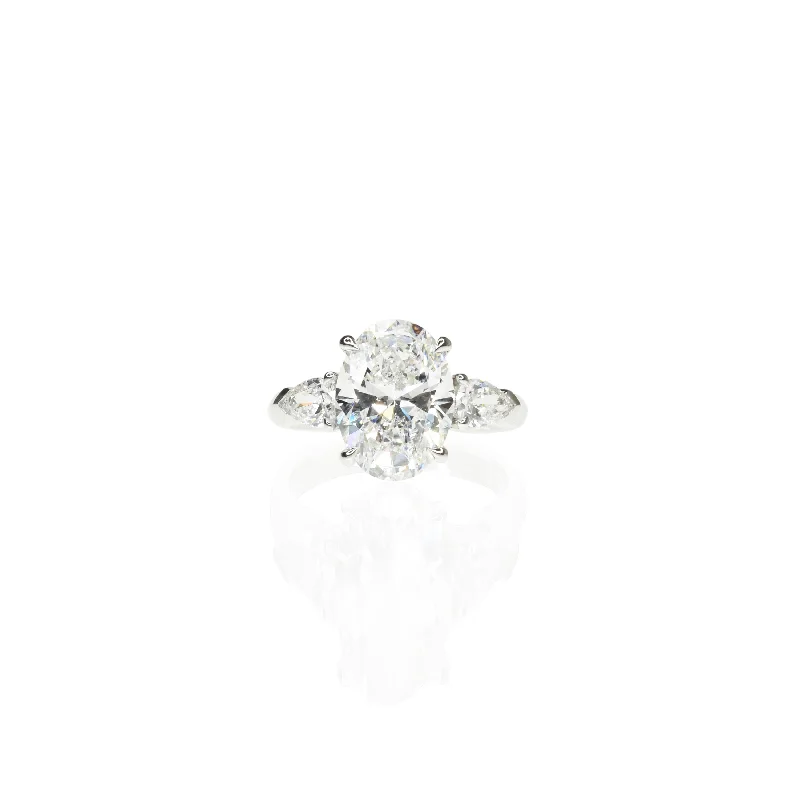 Oval Trilogy Ring With Pear Diamonds